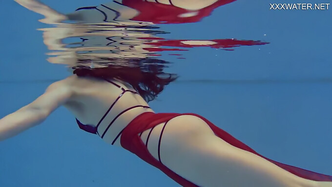 Marfa, a slender Russian teen, swims in the nude in a high-definition video